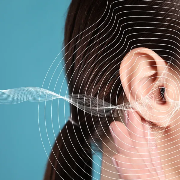 Noise-induced gearing loss concept. Closeup of woman's ear and sound waves illustration on light blue background